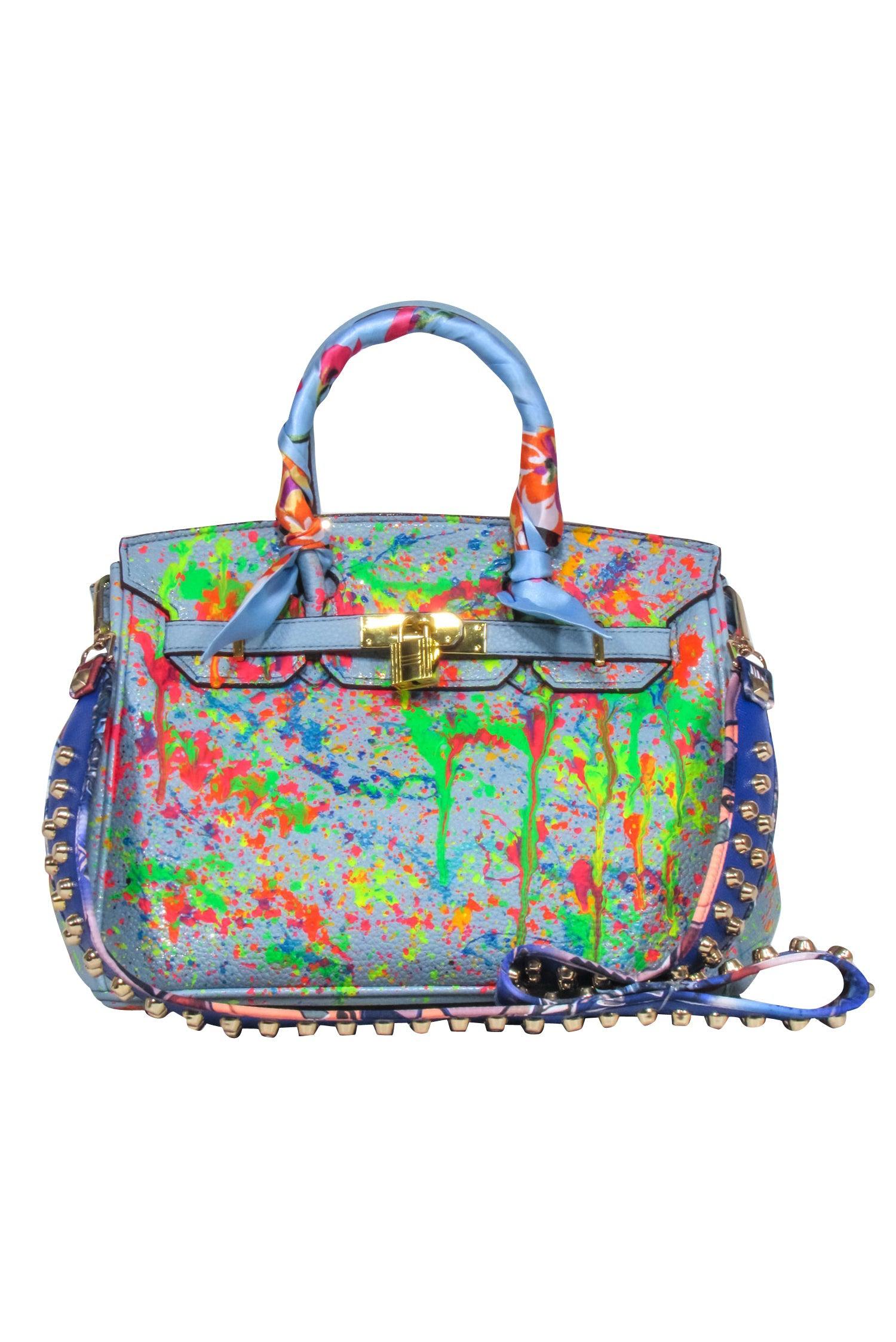 Anca Barbu's Rebel-Inspired Blue Pebbled Satchel with Paint Splatter