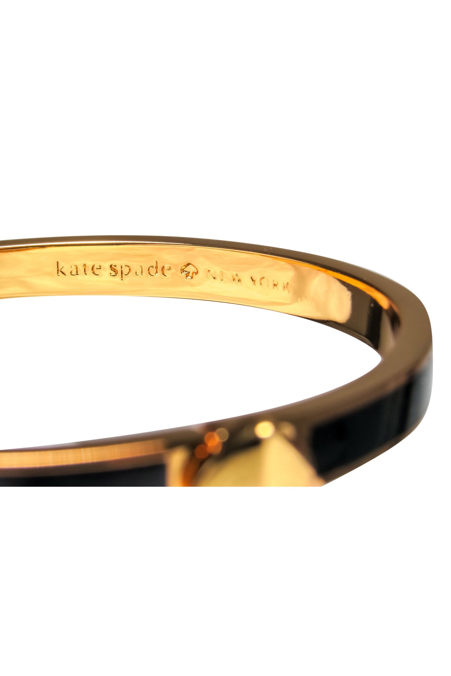 Kate Spade's Stunning Gold-Toned Bangle with Black Enamel and Spade Closure