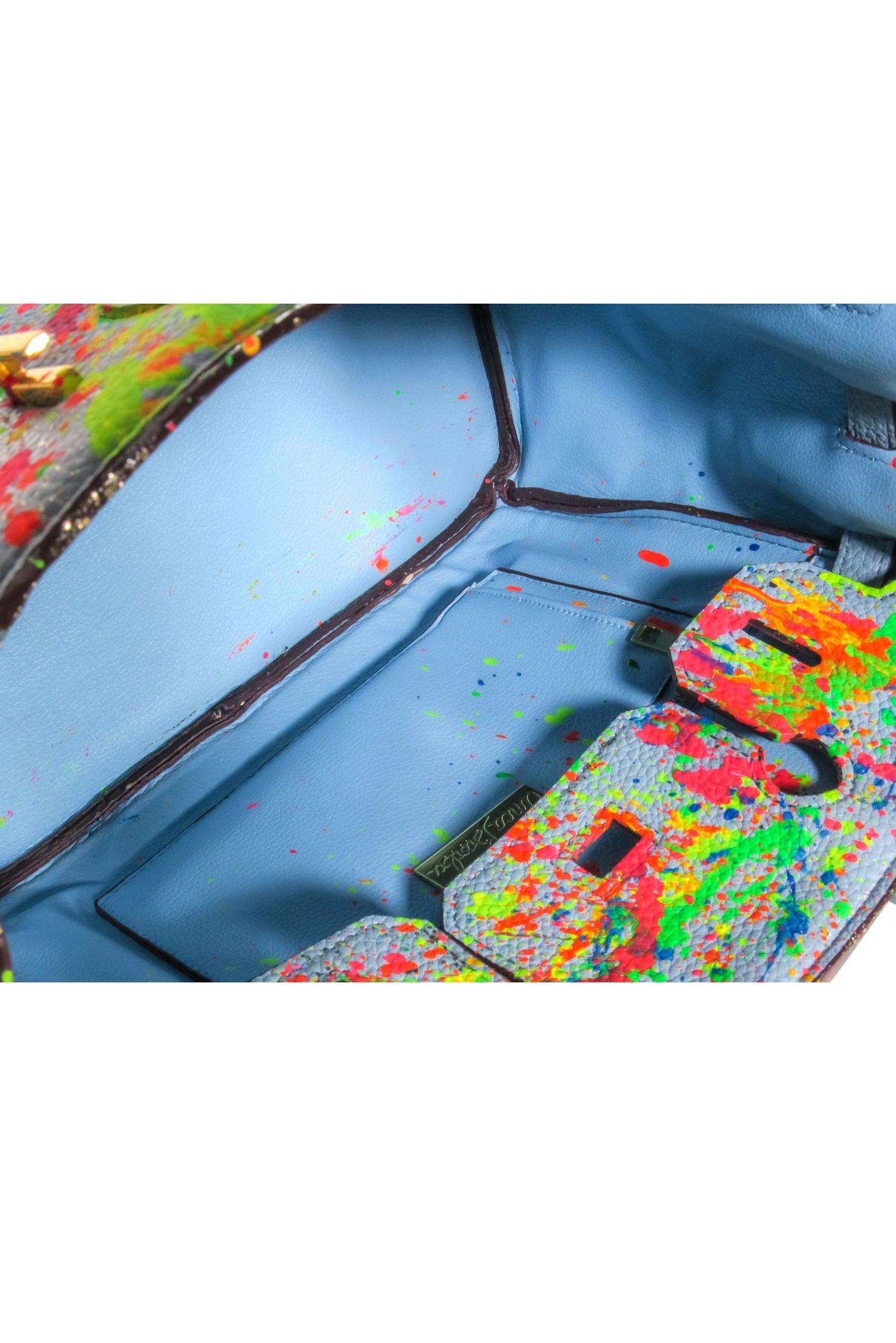 Anca Barbu's Rebel-Inspired Blue Pebbled Satchel with Paint Splatter