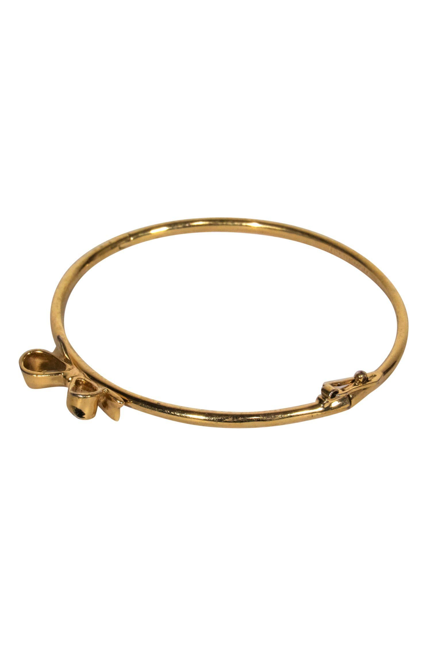 Kate Spade Glamorous Gold Bangle with Mini Bow - Elevate Your Style!