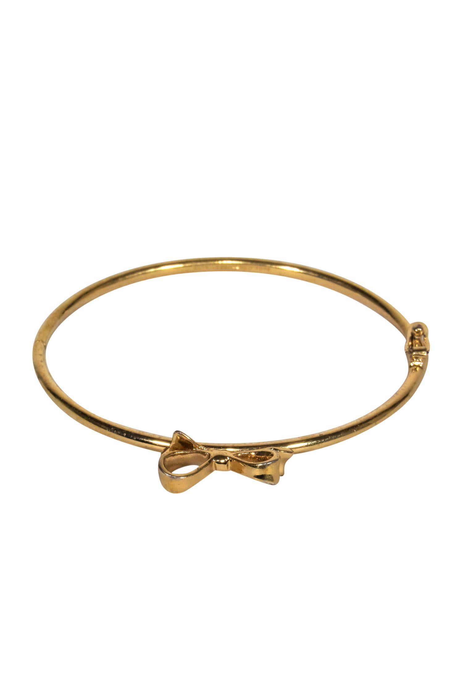 Kate Spade Glamorous Gold Bangle with Mini Bow - Elevate Your Style!