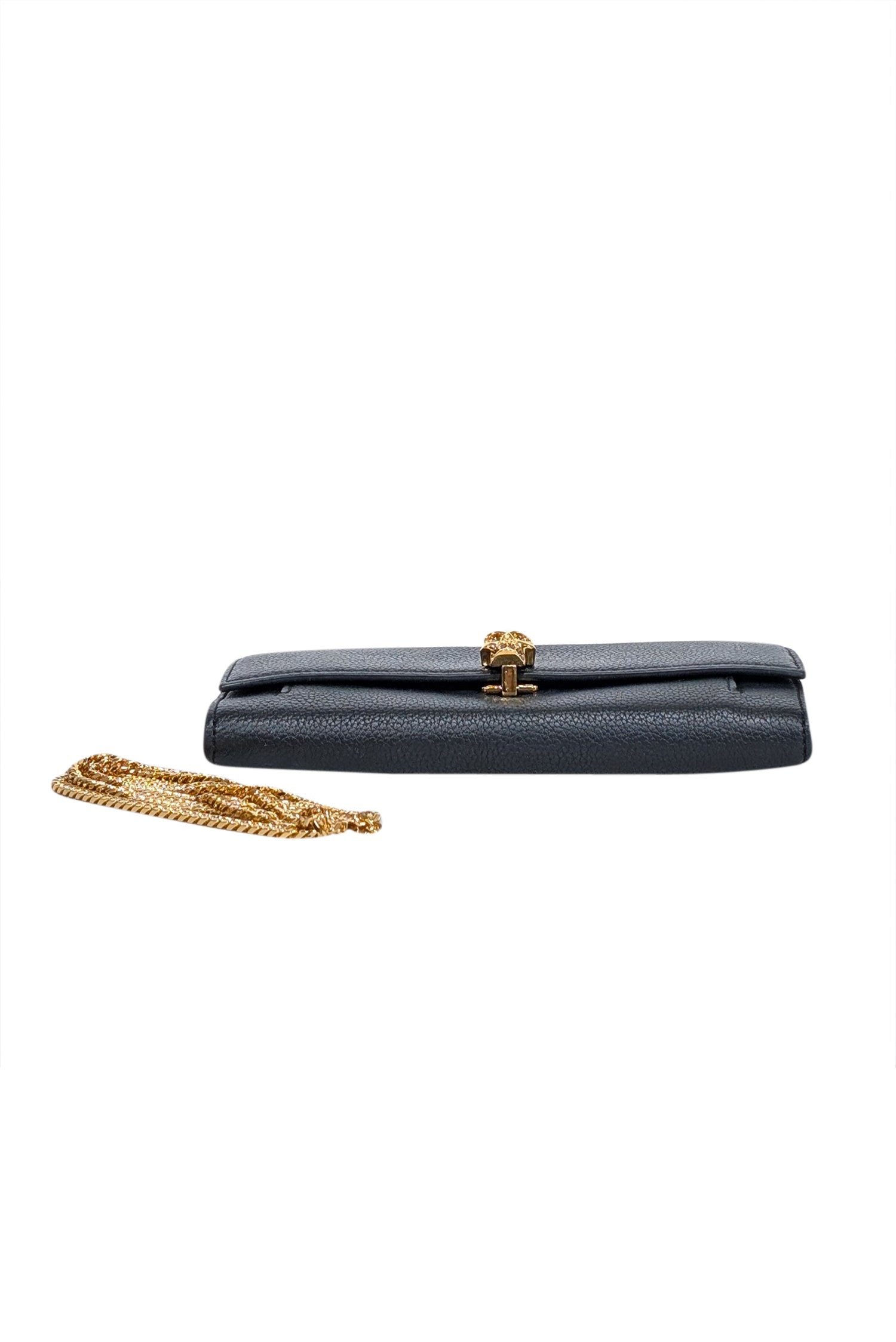 Alexander McQueen's Chic Black Leather Clutch with Stunning Gold Skull Closure