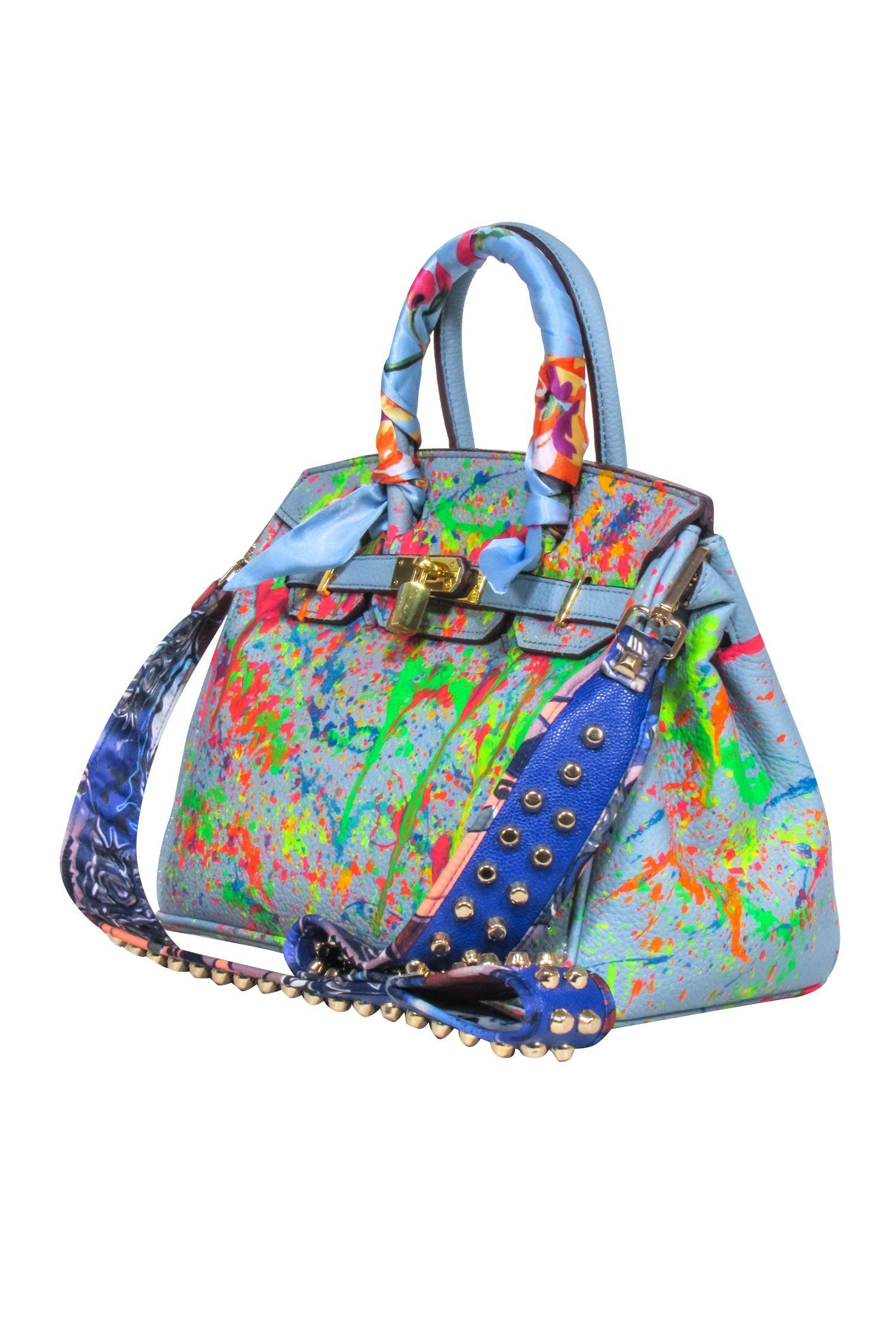 Anca Barbu's Rebel-Inspired Blue Pebbled Satchel with Paint Splatter