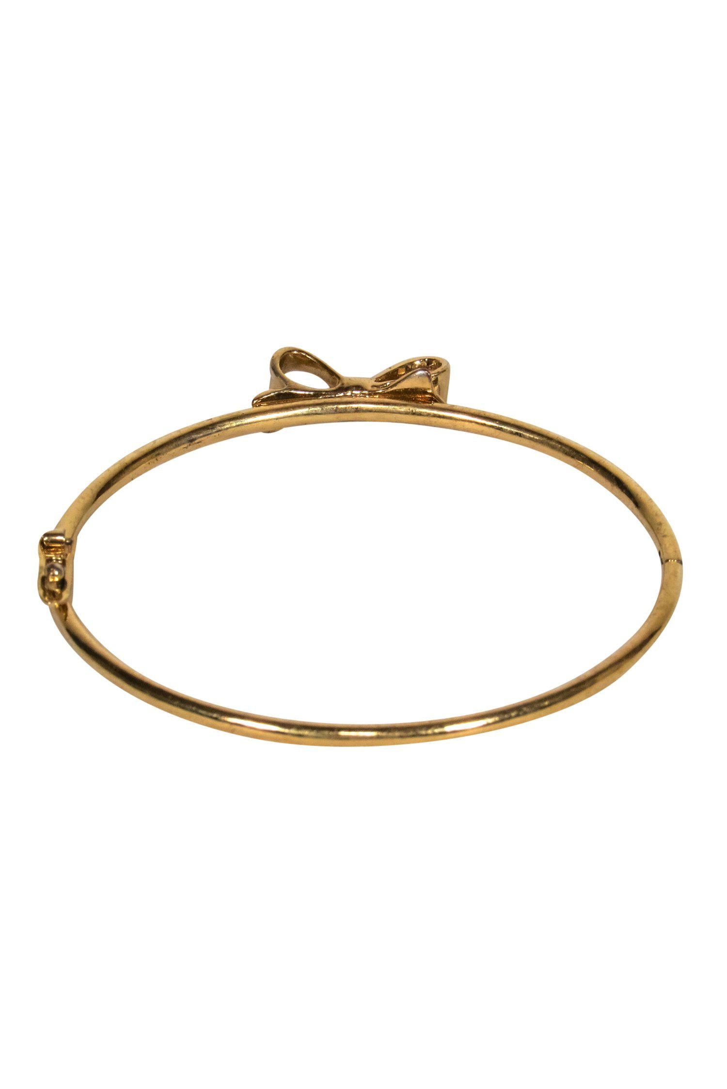 Kate Spade Glamorous Gold Bangle with Mini Bow - Elevate Your Style!