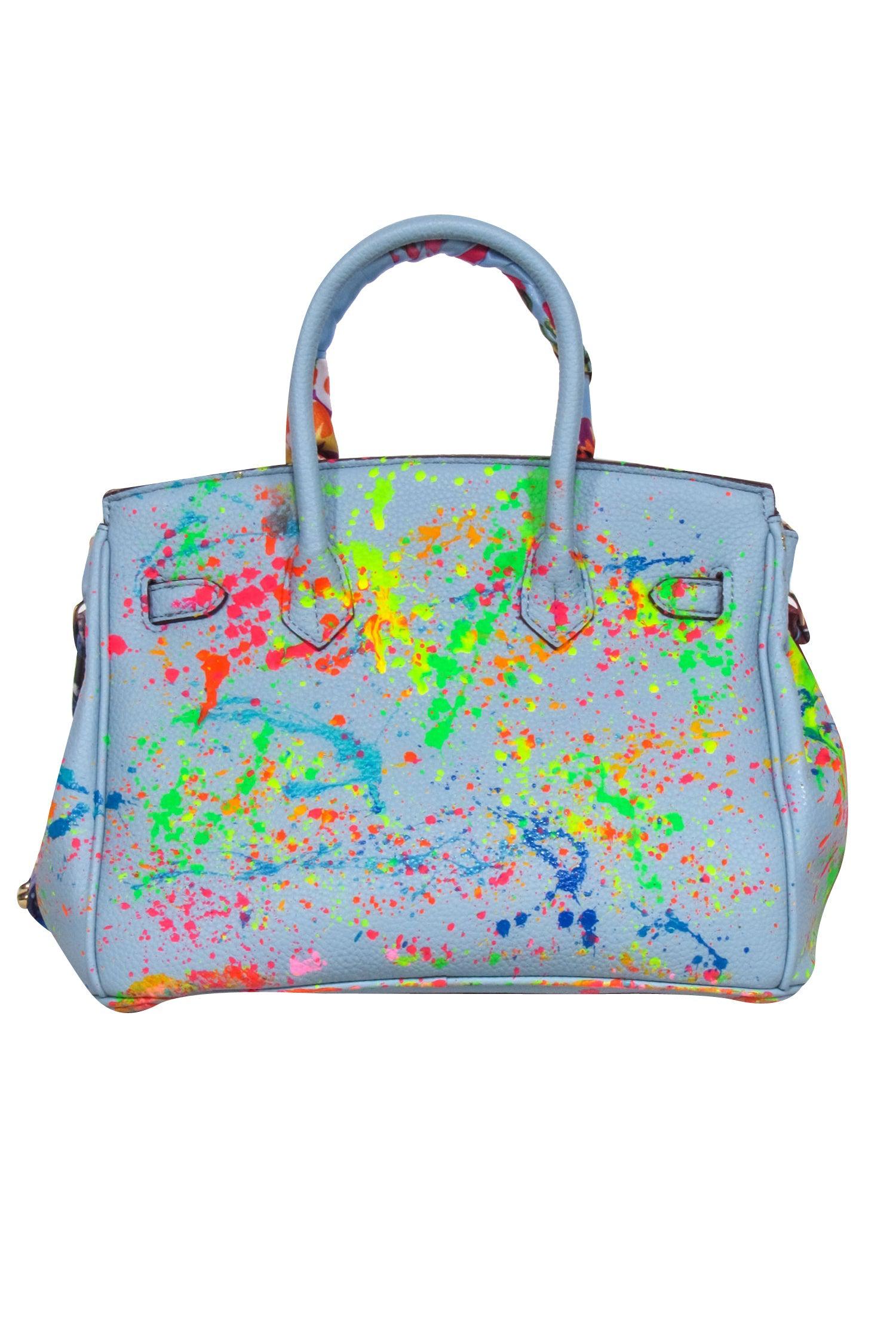 Anca Barbu's Rebel-Inspired Blue Pebbled Satchel with Paint Splatter