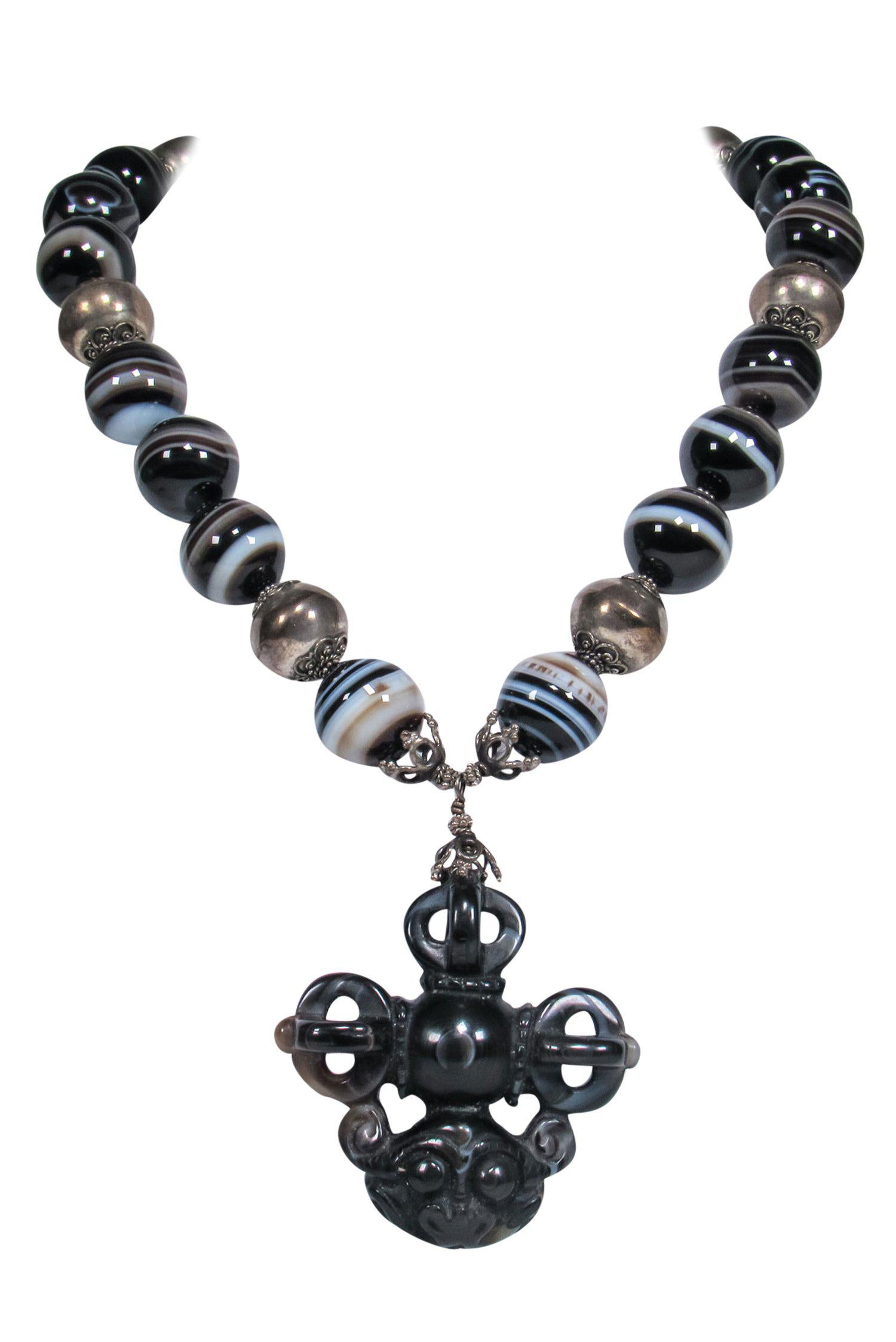 Natalie Baroni's Enchanting Black Bauble Gemstone Necklace with Monkey Pendant