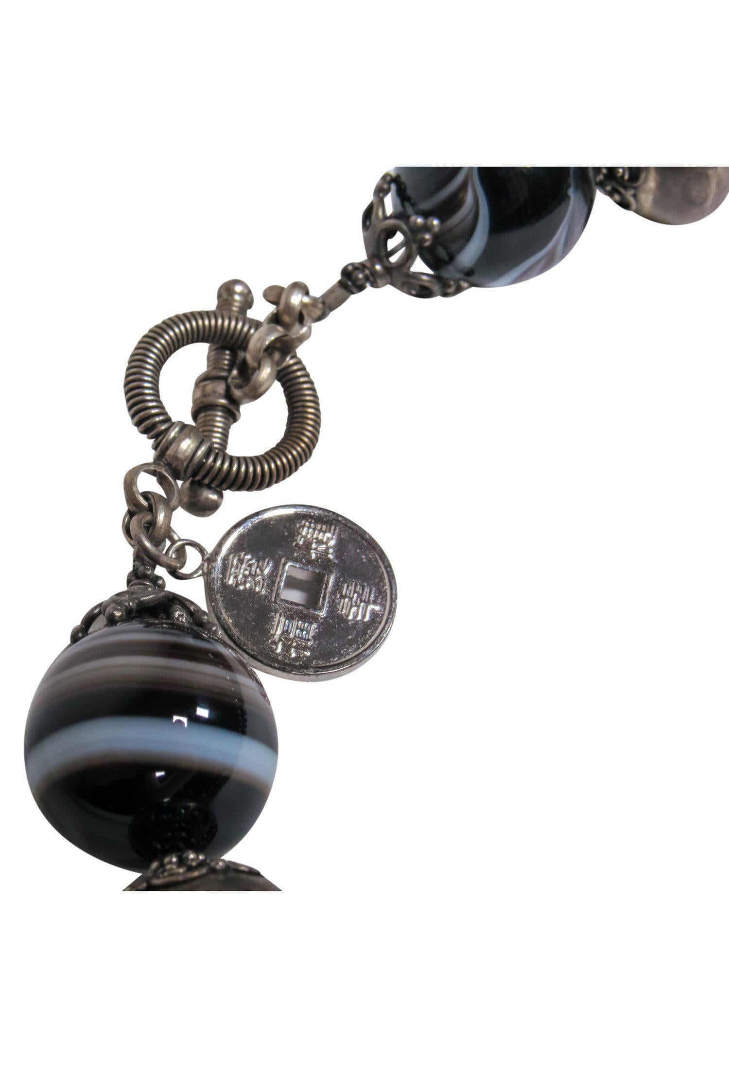 Natalie Baroni's Enchanting Black Bauble Gemstone Necklace with Monkey Pendant