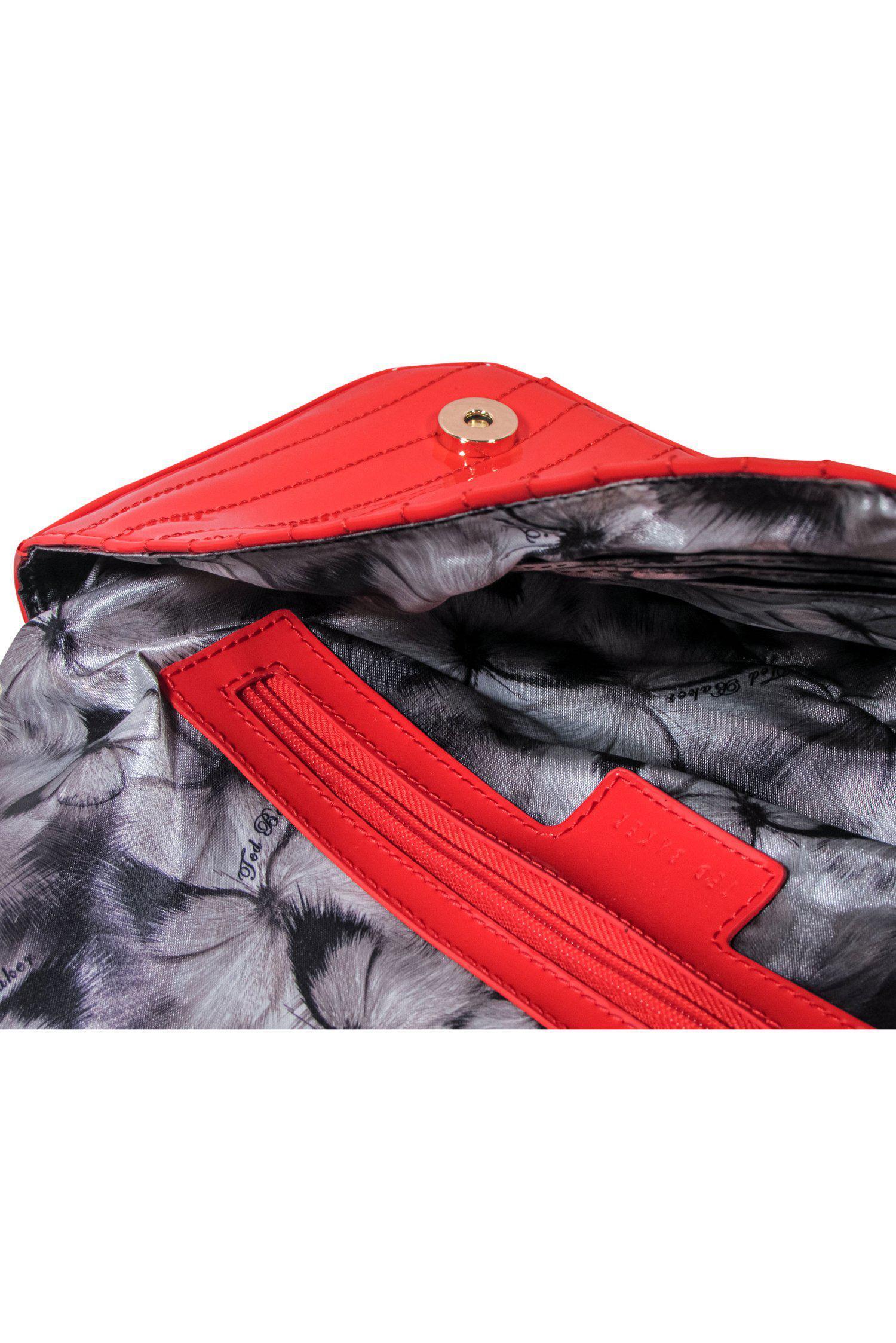 Ted Baker - Stunning Glossy Patent Oblong Snap Clutch with Scrolled Logo
