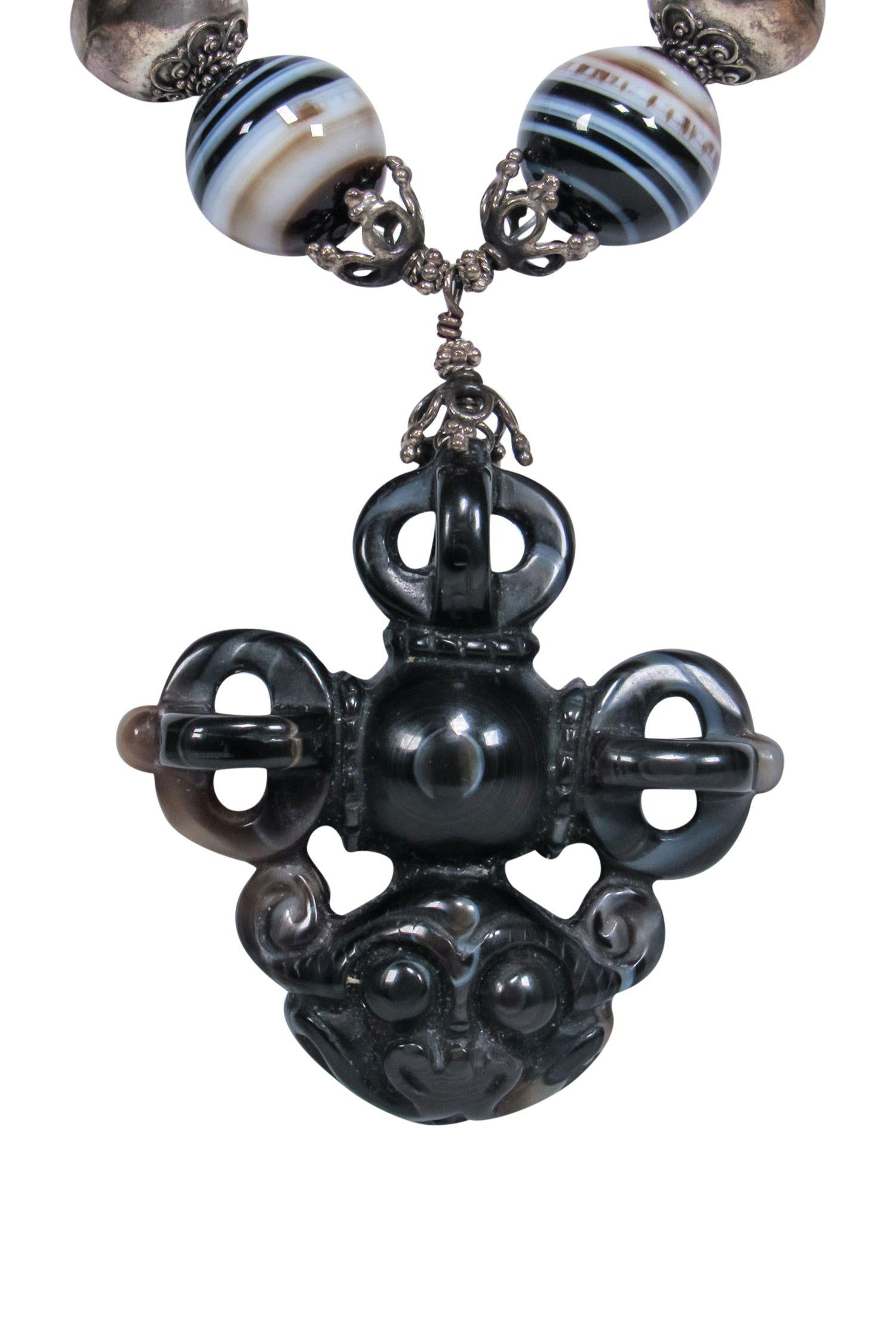 Natalie Baroni's Enchanting Black Bauble Gemstone Necklace with Monkey Pendant